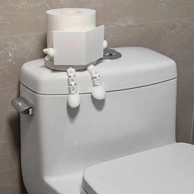 Porte papier toilette blanc petit lecteur porte un livre assis 