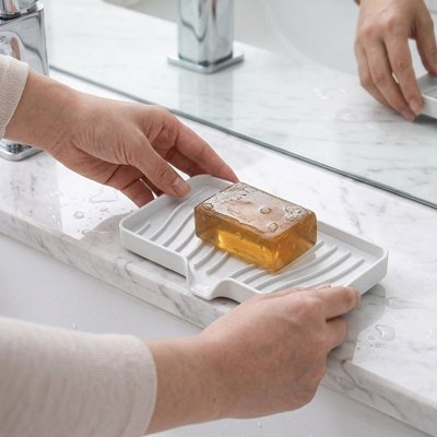 Porte savon douche avec tracés d'évacuation, blanc en silicone
