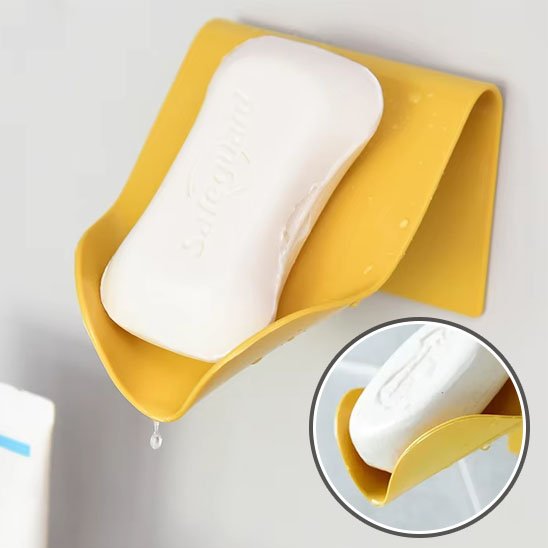 Porte savon mural fixé au mur jaune 