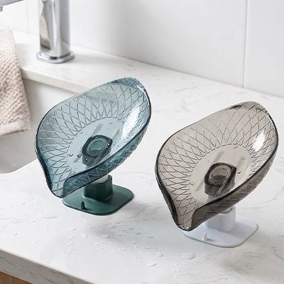 Porte savon Sa structure inclinée en forme de V ou de feuille dirige l'eau directement vers le lavabo.