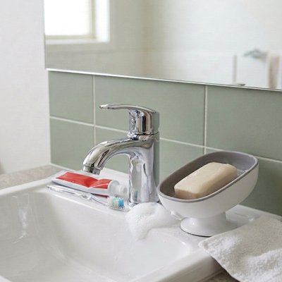 Porte savon ventouse bicolore gris blanc incliné, trou d'évacuation
