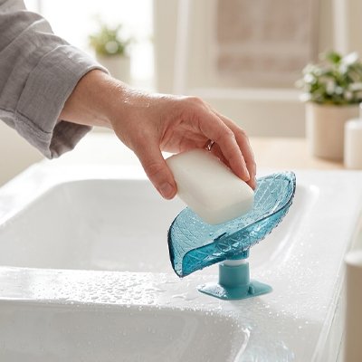 Porte savon ventouse design en forme de feuille doté d'un système d'évacuation 