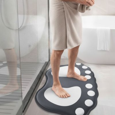 Forme de pieds stylisés avec motifs de galets bicolores gris blanc