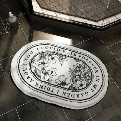 Tapis salle de bain ovale grand format motifs fins noir sur blanc 