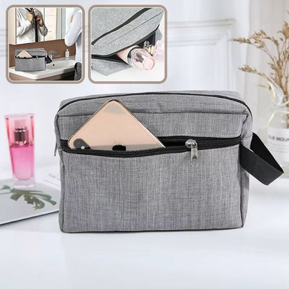 Trousse de toilette grise à la fermeture éclair noire de forme rectangulaire 