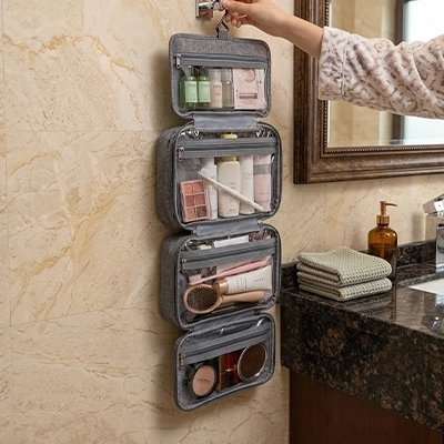 Trousse de toilette grise, suspendue, pliable, quatre compartiments de rangement transparents à fermeture éclair